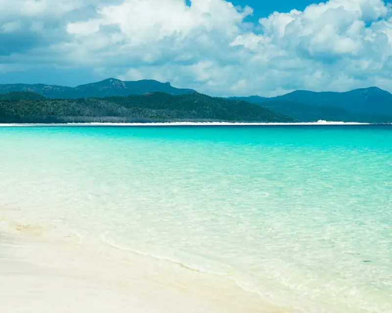 White sand and clear shallow water along Whitehaven Beach